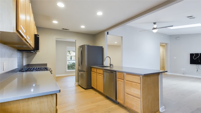 kitchen with sink, light hardwood / wood-style flooring, light brown cabinets, appliances with stainless steel finishes, and ceiling fan