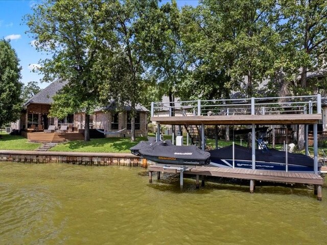 view of front of property featuring a garage and a front lawn