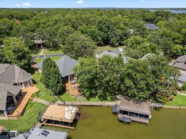 bird's eye view with a water view and a forest view