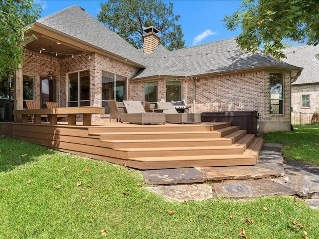 rear view of property with brick siding, a yard, an outdoor living space, and roof with shingles