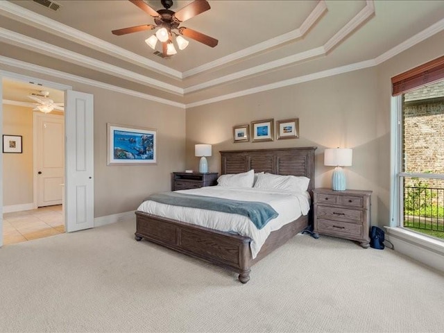 bedroom with light carpet, ornamental molding, a raised ceiling, and baseboards