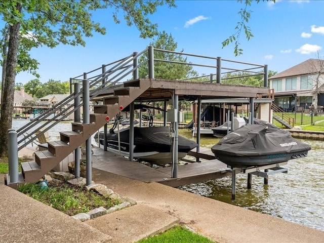 view of dock featuring a water view, stairs, and boat lift