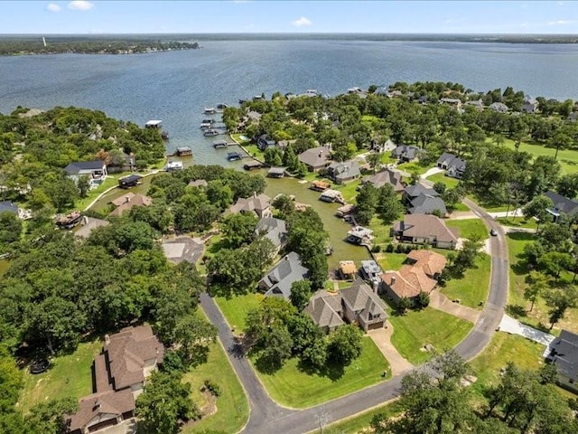 drone / aerial view featuring a residential view and a water view