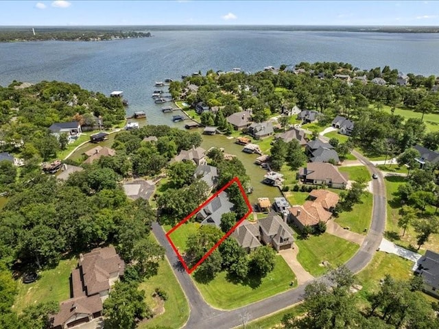 bird's eye view featuring a residential view and a water view