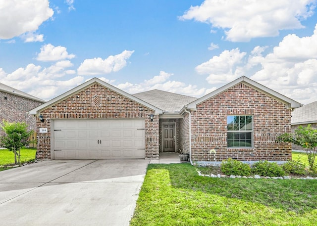 view of front of home featuring a garage and a front yard