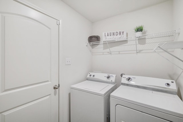 laundry room featuring washing machine and dryer