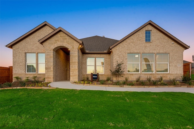 view of front of house with a yard