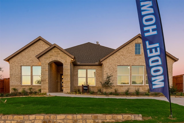 view of front of home with a lawn