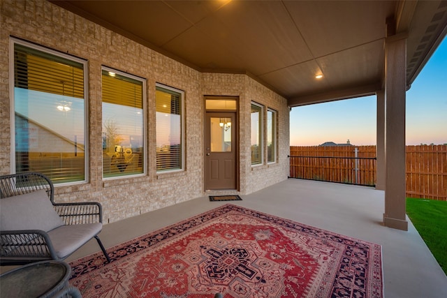 view of patio terrace at dusk