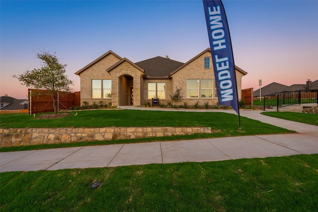 view of front of house with a lawn