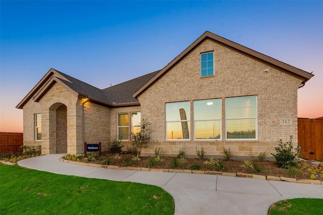 view of front of property with a lawn