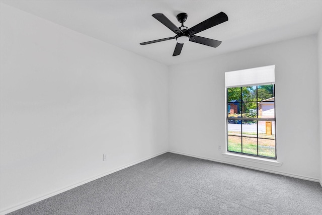 unfurnished room with carpet flooring and ceiling fan