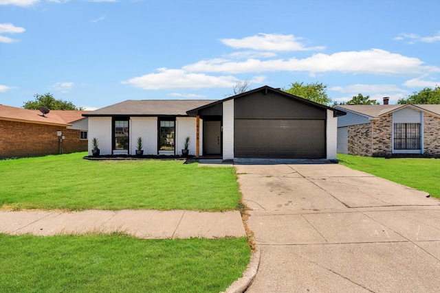 ranch-style house with a garage and a front yard