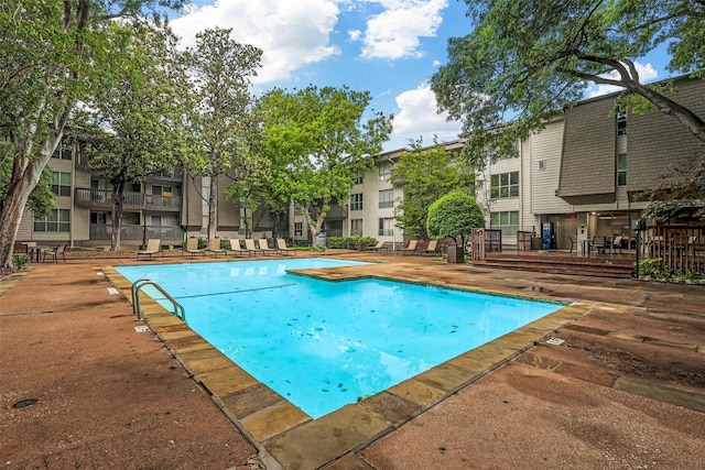 view of pool featuring a patio