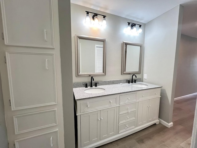 bathroom featuring vanity and wood-type flooring