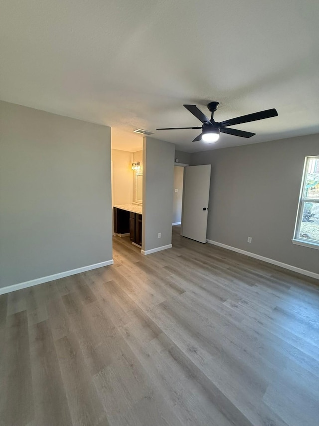 spare room with ceiling fan and light hardwood / wood-style floors