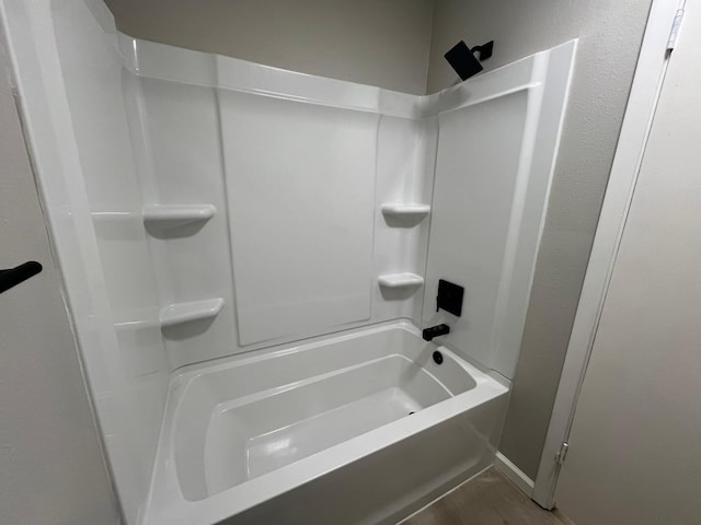 bathroom with shower / washtub combination