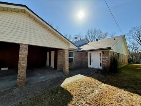 rear view of house with a garage