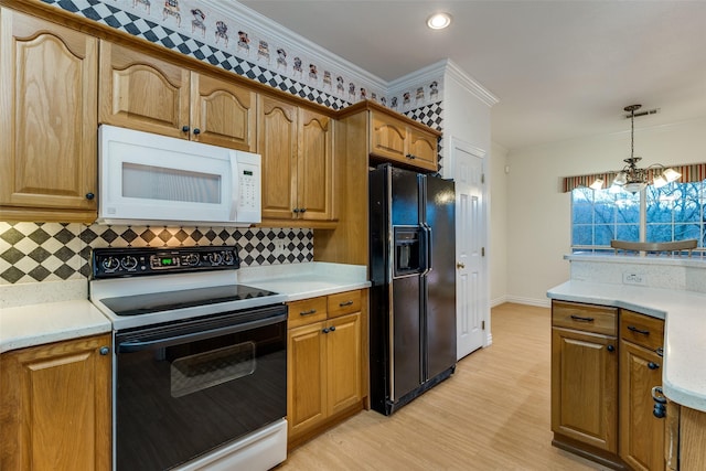 kitchen with pendant lighting, backsplash, ornamental molding, black fridge with ice dispenser, and electric stove