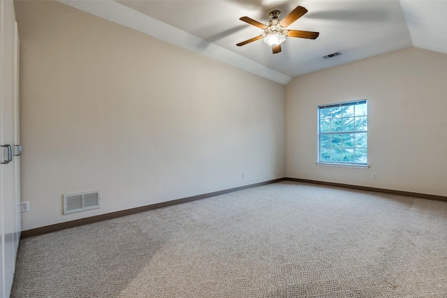 spare room with carpet floors, ceiling fan, and vaulted ceiling