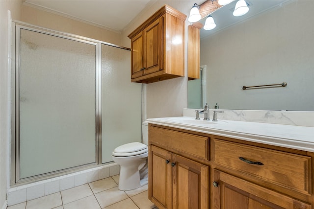 bathroom with ornamental molding, vanity, an enclosed shower, toilet, and tile patterned floors