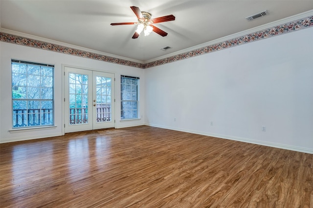 unfurnished room with french doors, ceiling fan, crown molding, and hardwood / wood-style flooring