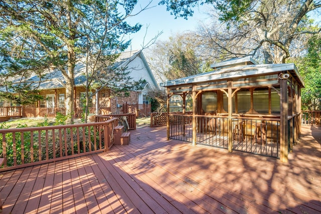 wooden deck with a sunroom