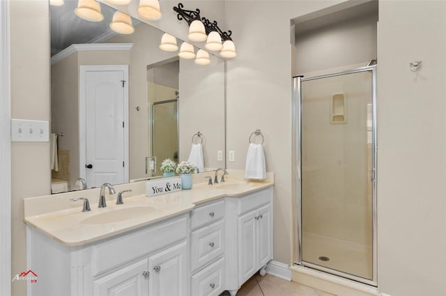 bathroom with vanity, an enclosed shower, crown molding, and tile patterned flooring