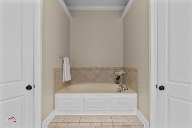 bathroom featuring a washtub, tile patterned floors, and ornamental molding