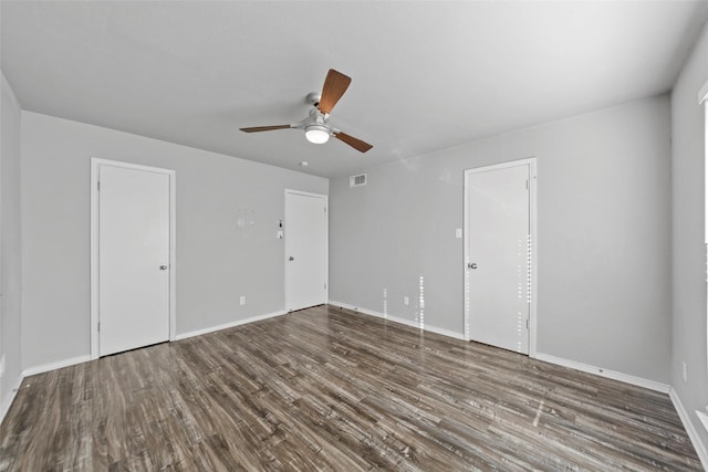 empty room featuring hardwood / wood-style flooring and ceiling fan