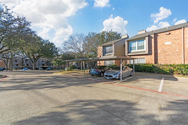 view of parking / parking lot with a carport