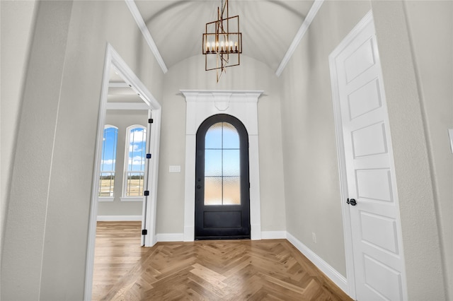 entrance foyer featuring lofted ceiling, parquet floors, and a notable chandelier