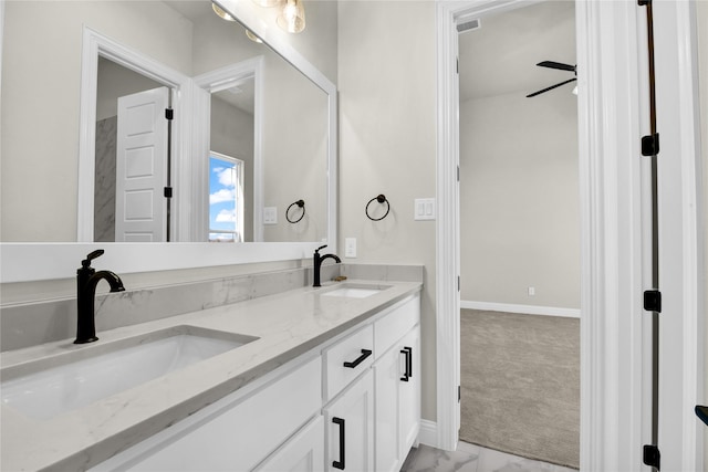 bathroom featuring ceiling fan and vanity