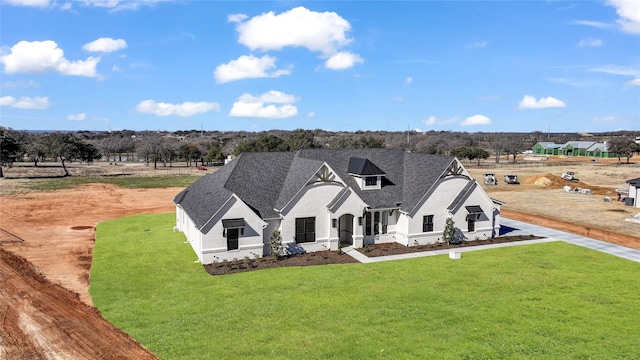 view of front of property with a front lawn