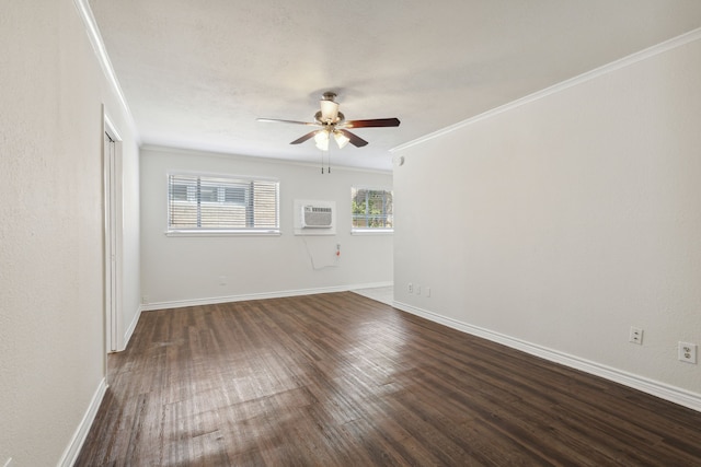 spare room featuring dark hardwood / wood-style flooring, ceiling fan, crown molding, and a wall mounted AC