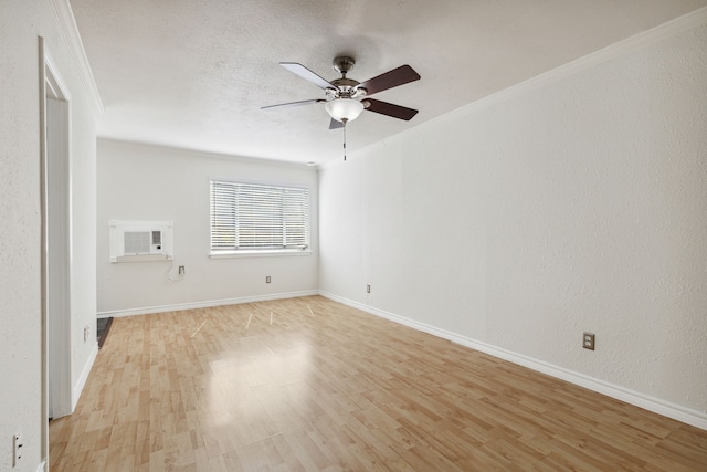 spare room with crown molding, ceiling fan, a textured ceiling, and light wood-type flooring