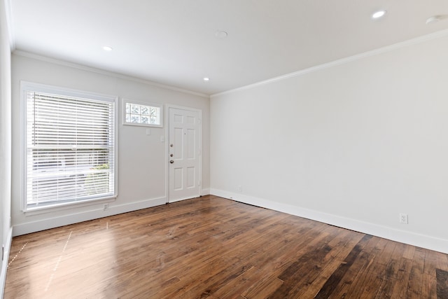 entryway featuring crown molding and hardwood / wood-style flooring