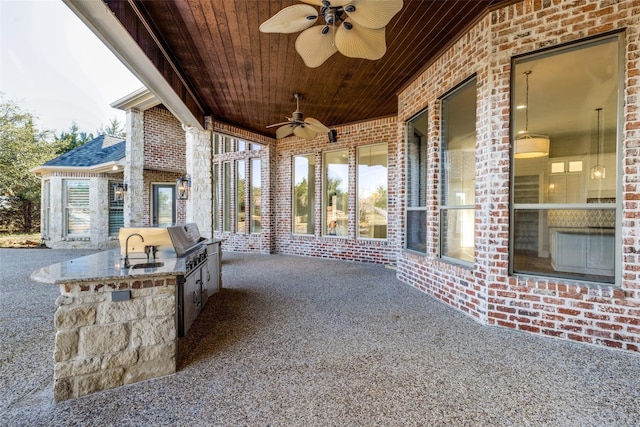 view of patio / terrace featuring area for grilling, sink, ceiling fan, and an outdoor kitchen