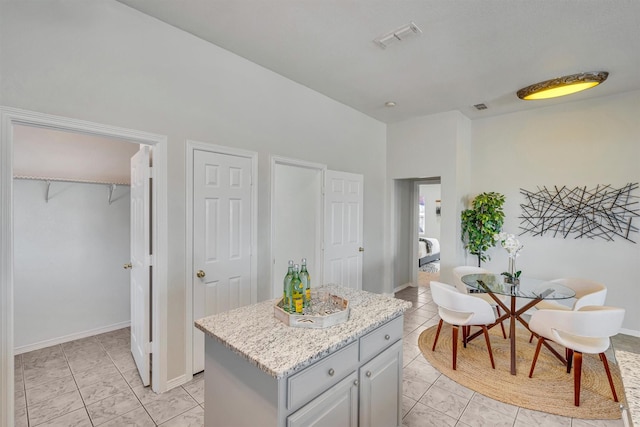 kitchen featuring gray cabinetry and a kitchen island