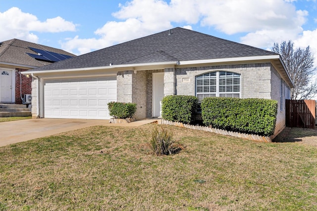 single story home with a garage and a front yard