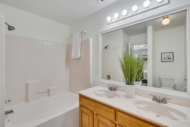 full bathroom featuring vanity, shower / bathing tub combination, and toilet