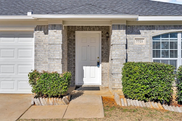 view of exterior entry featuring a garage