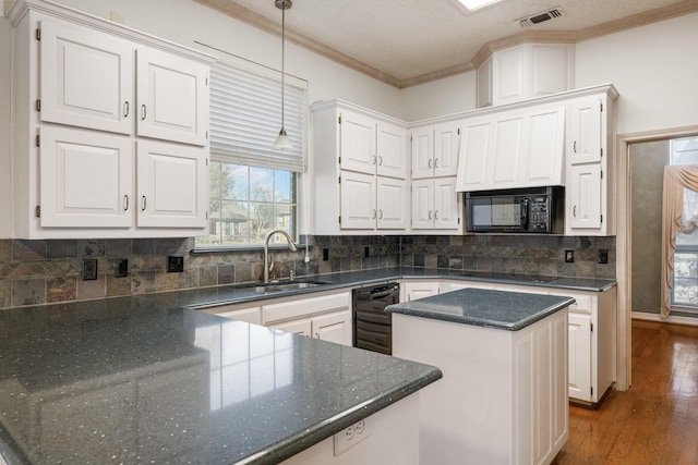 kitchen with dark wood-type flooring, sink, white cabinetry, pendant lighting, and black appliances