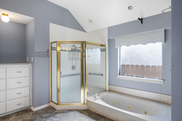 full bath featuring lofted ceiling, a stall shower, a jetted tub, and a textured ceiling