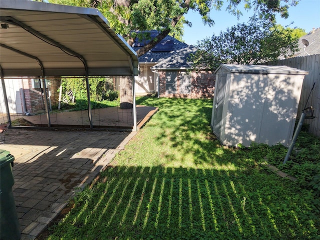 view of yard with a storage shed, fence, and an outdoor structure