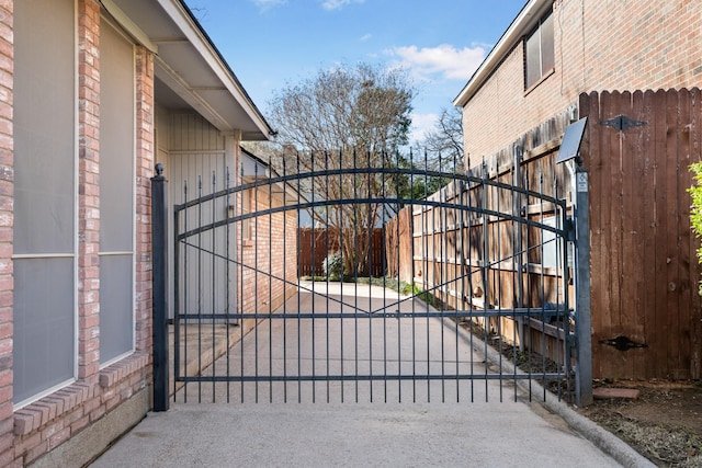 view of gate featuring fence