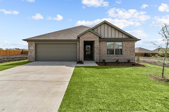 view of front facade with a garage and a front yard