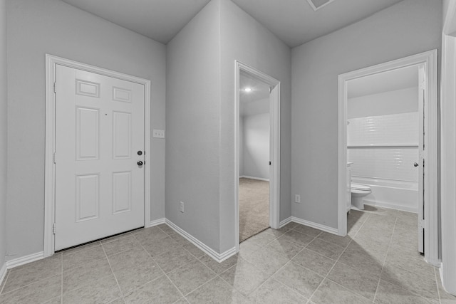 foyer with light tile patterned floors