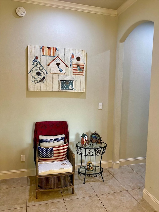 living area featuring crown molding and tile patterned floors