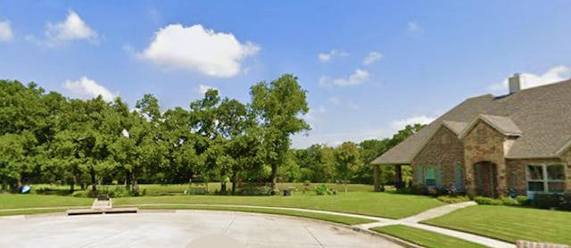 view of community featuring a lawn